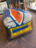 Rear end of GTP Motorways tinplate coach showing Made in England and G.T.P. 552 markings on yellow and blue lithographed rear panel