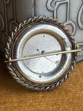 Back view of Victorian tintype photo brooch with C-clasp fastening