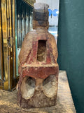 Back of antique Chinese wood figure showing open consecration cavity and red lacquer