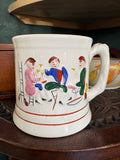 Side view of an antique Staffordshire frog mug showing the handle and painted scene of three figures