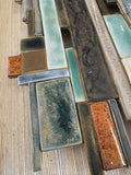 Detail of textured ceramic tiles on a hessian backing in Anne Plant's Krimanchuli wall panel
