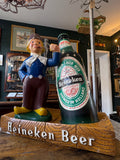 Retro Heineken pub display statue with large bottle and Dutch character