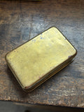 Underside of Princess Mary brass tobacco tin
