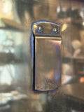 Close-up of clip fitting on back panel with two rivets