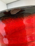 Close-up of small glaze chip on underside of vase rim