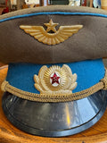Close-up of a gilt Soviet Air Force winged star above an officer's cockade with red enamel star
