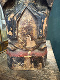 Detail of worn gilt and paint losses to lap of antique Chinese wood figure
