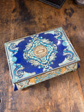 Vintage Russian Red October confectionary tin box, top view.