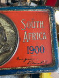 Close-up of South Africa 1900 inscription on chocolate tin
