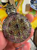 Front view of vintage 1970s Czech amethyst glass perfume bottle with silver filigree overlay and pink rhinestones