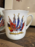 WWI commemorative cup showing Allied flags and In Freedom's Cause banner