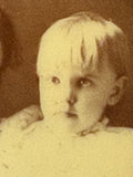 Close-up of child's face in Victorian tintype brooch portrait
