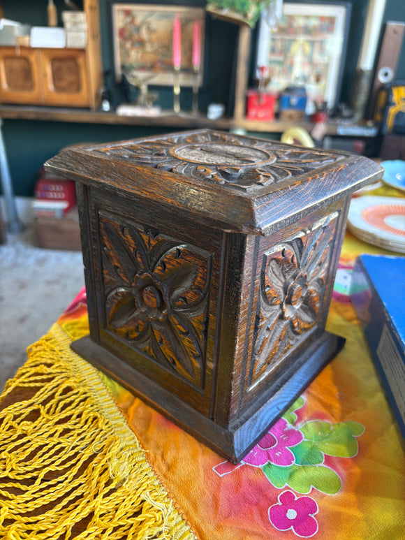 Carved Victorian oak ecclesiastical collection box with foliate design on the side panels.