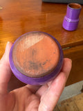 Base of small West German pottery pot with purple glaze