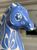 Close-up of Pablo Zabal Chile pottery head with painted details. 
