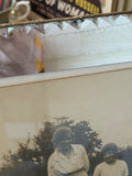 Art Deco mirrored frame with faceted edge, photograph visible inside