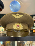 Soviet Air Force officer's olive peaked cap with gilt winged star badge and red enamel hammer and sickle cockade