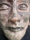 Close-up of facial features on plaster maquette head