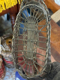 Interior of wine basket viewed from above, showing woven base
