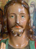 Close-up of Jesus face on vintage chalkware bust with painted features