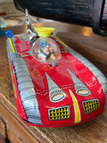 Vintage tin space rocket car