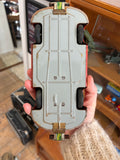 Underside of Gescha R-558 tinplate Porsche 356 showing friction mechanism and Gescha branded axle clips