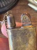 Top detail of vintage Soviet lighter with star screw and chain