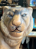 Close-up front portrait of the vintage ceramic tiger planter showing hand-painted facial features including watchful eyes with black lash detailing, broad muzzle, painted whiskers, and matte sandy grey glaze with age wear.