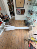 Bonaldo Eos lamp lying on wooden floor showing full length and trumpet base