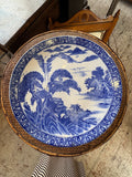Large Japanese blue and white ceramic charger with scenic landscape and pine trees, early 20th century