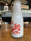 Old shop display milk bottle