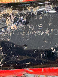 Close-up of worn ‘Made in Germany’ marking on car underside
