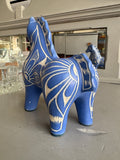 Rear angle of blue Pablo Zabal pottery horse figurine. 