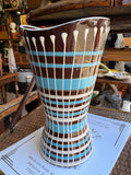 West German drip glaze vase displayed on antique shop table