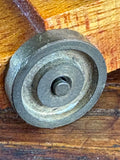 Close-up of brass wheel on hand-made miniature cannon carriage