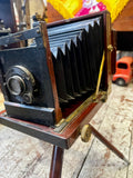 Side view of Victorian folding plate camera showing extended bellows mechanism