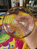 Inside view of flared 1950s cocktail glass with gold stripes
