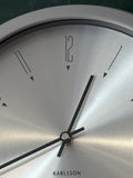 Close-up of Karlsson wall clock dial showing stylised number markers