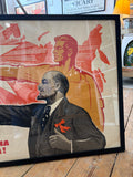 Close-up detail of the right side of the Konuhov poster showing Lenin in profile in grey tones wearing a suit with a red bow, and behind him a heroic Soviet worker figure rendered in bold red and gold, set against a dynamic abstract red background.