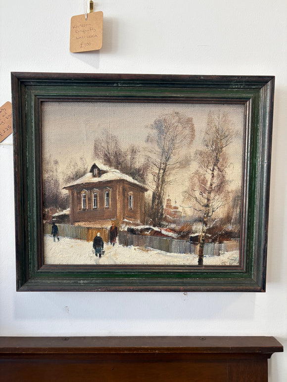 Framed oil painting of Russian street scene with church domes in the distance