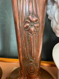 Detail of single poppy flower motif on copper vase stem