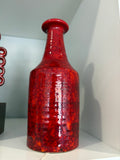 Vintage red glazed ceramic vase by Manfred Buchholz showing tall neck and flared collar