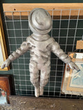 Silver astronaut wall art with detailed suit texture and helmet