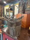 Wine basket from the end, showing flared rim and base edging