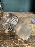 Close-up of stopper on Art Deco glass perfume bottle