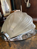Side view of vintage Art Deco wall light with shell design shade