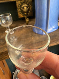 Close-up of misshapen rim on Georgian port glass
