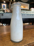 Old shop display milk bottle