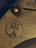 Inside the back of Gustav Becker mantel clock showing crown-over-A mark