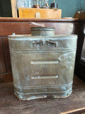 Back view of antique copper backpack vineyard sprayer